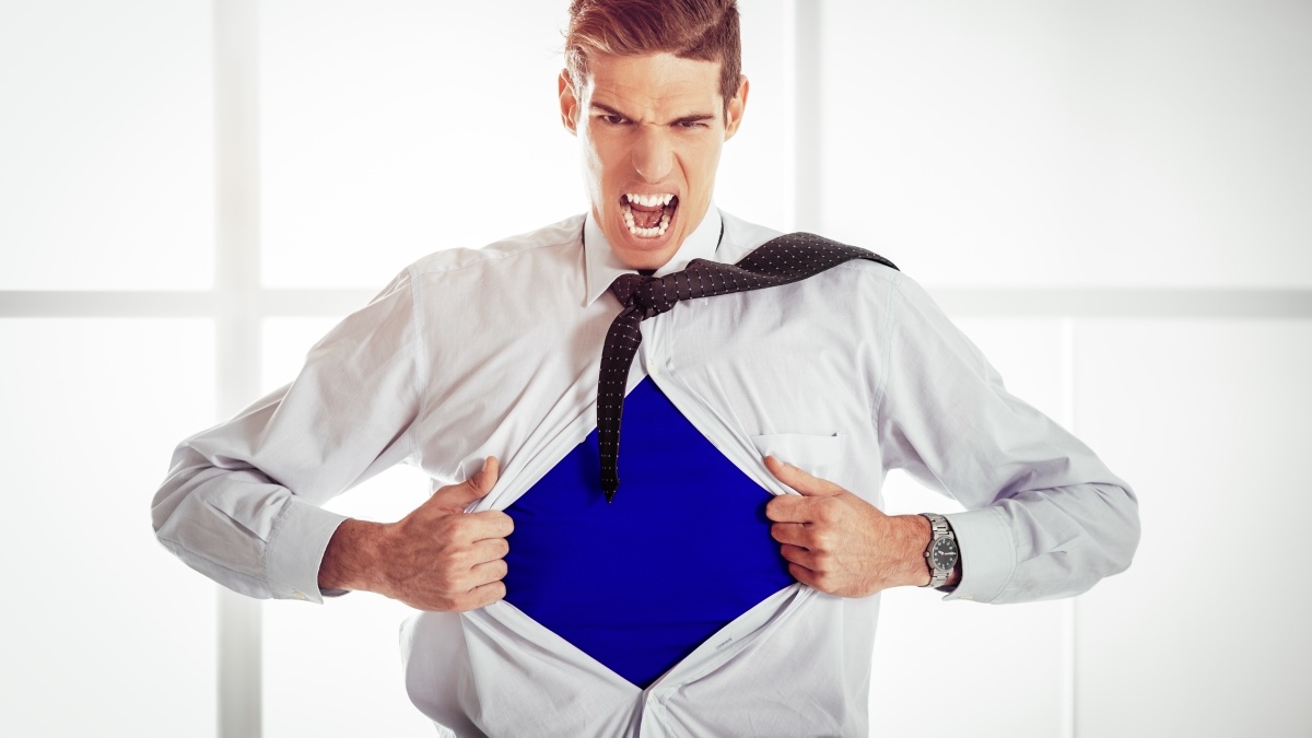 Superhero teacher opening up shirt to reveal superhero costume