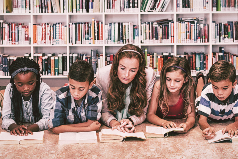 Teacher conducting close reading with a group of students